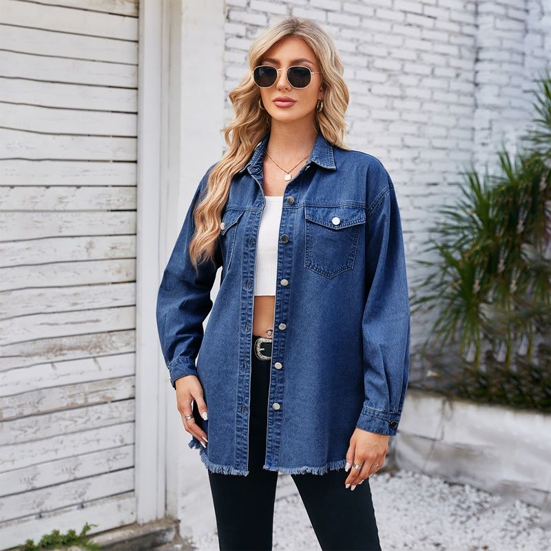 Women's oversized button down long sleeve denim shirt with frayed hem in navy, front view