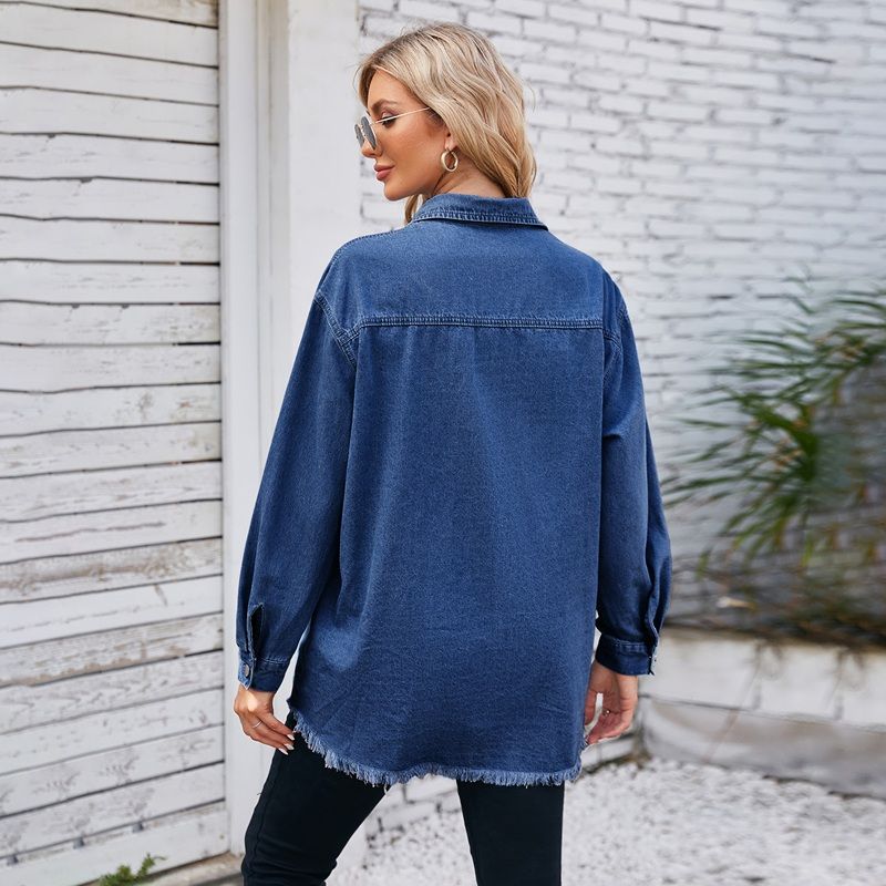 Women's oversized button down long sleeve denim shirt with frayed hem in navy, back view